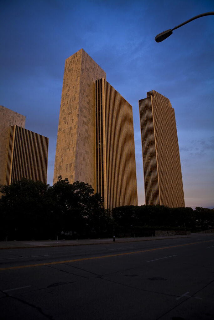 The Agency buildings and the Erastus Corning Tower are pictured in Albany, NY. The Agency buildings and the Corning Tower are part of The Governor Nelson A. Rockefeller Empire State Plaza (known commonly as the Empire State Plaza and less formally as the South Mall).
