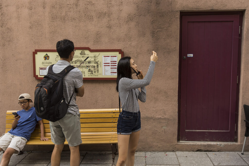 Tourists take a photo in front of a door in the Quebec city neighborhood of Petit Champlain in Quebec city. The "red magic door" plays a major role in the episode 2 of the popular Korean TV show Goblin: The Lonely and great God